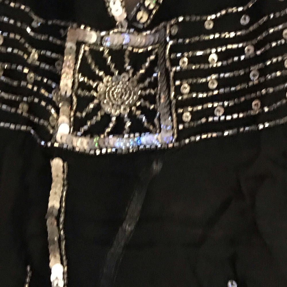 Sequined sheer black rayon halter top.